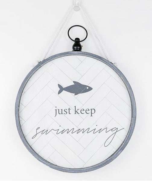 Reversible round crabby/swimming sign